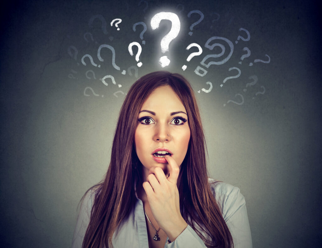 Surprised amazed young woman with many questions and no explanation or answer